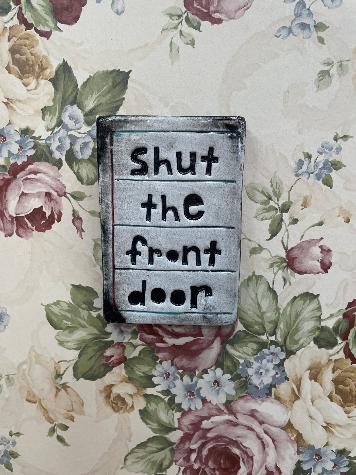 Shut the front door tile.