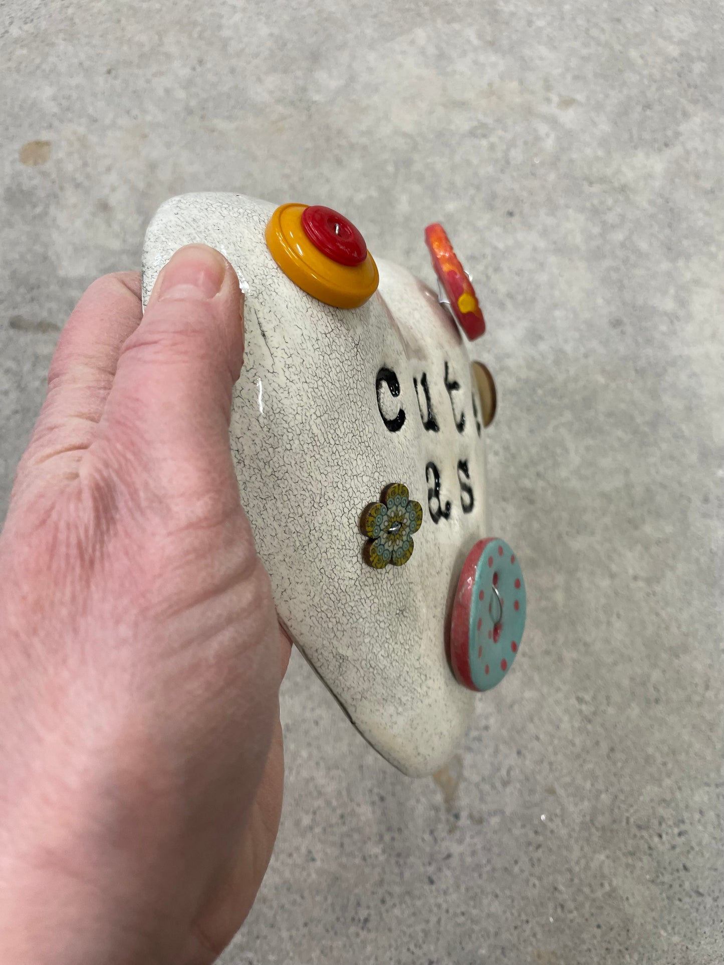 Cute as a button wall heart.