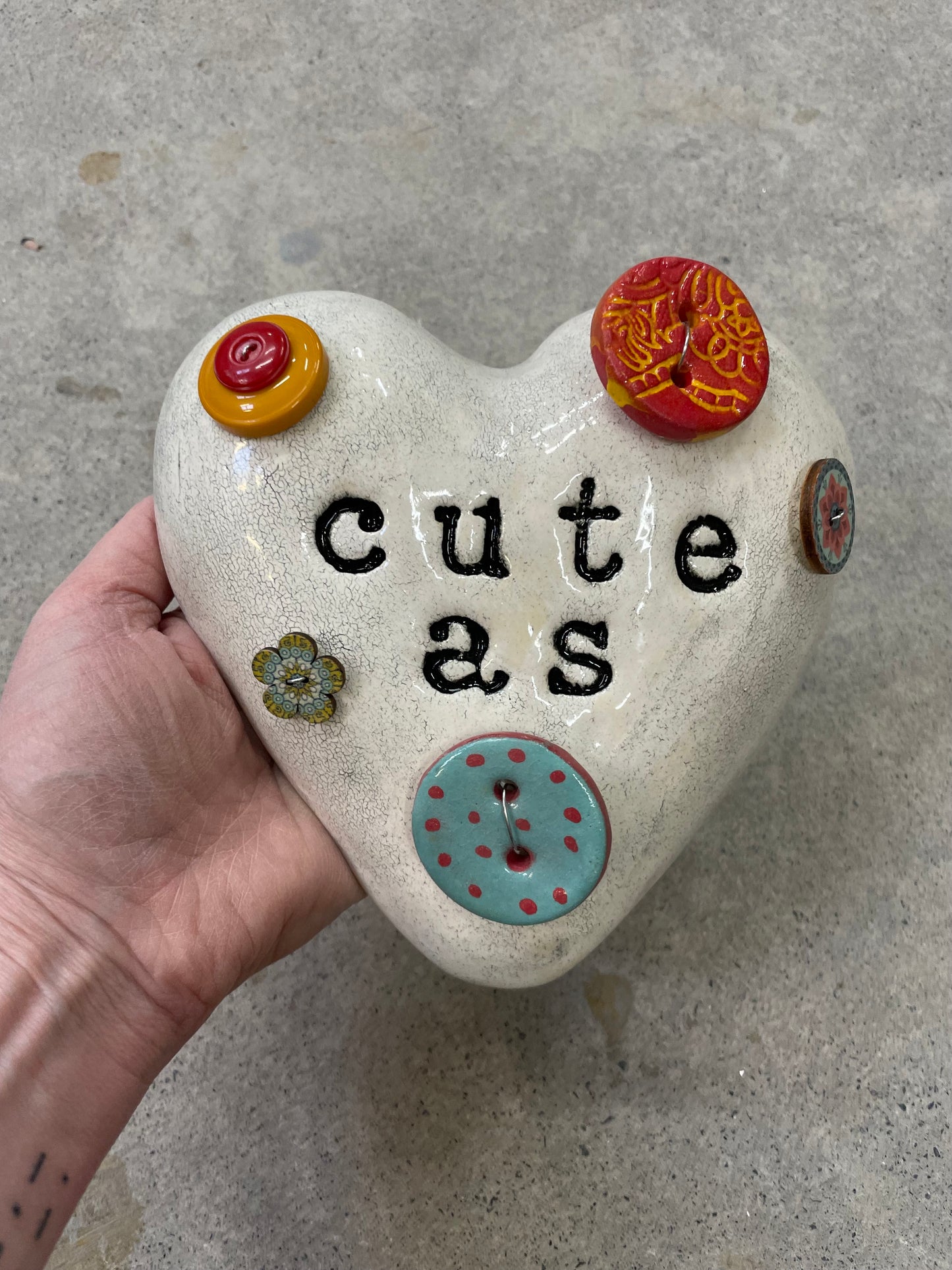 Cute as a button wall heart.