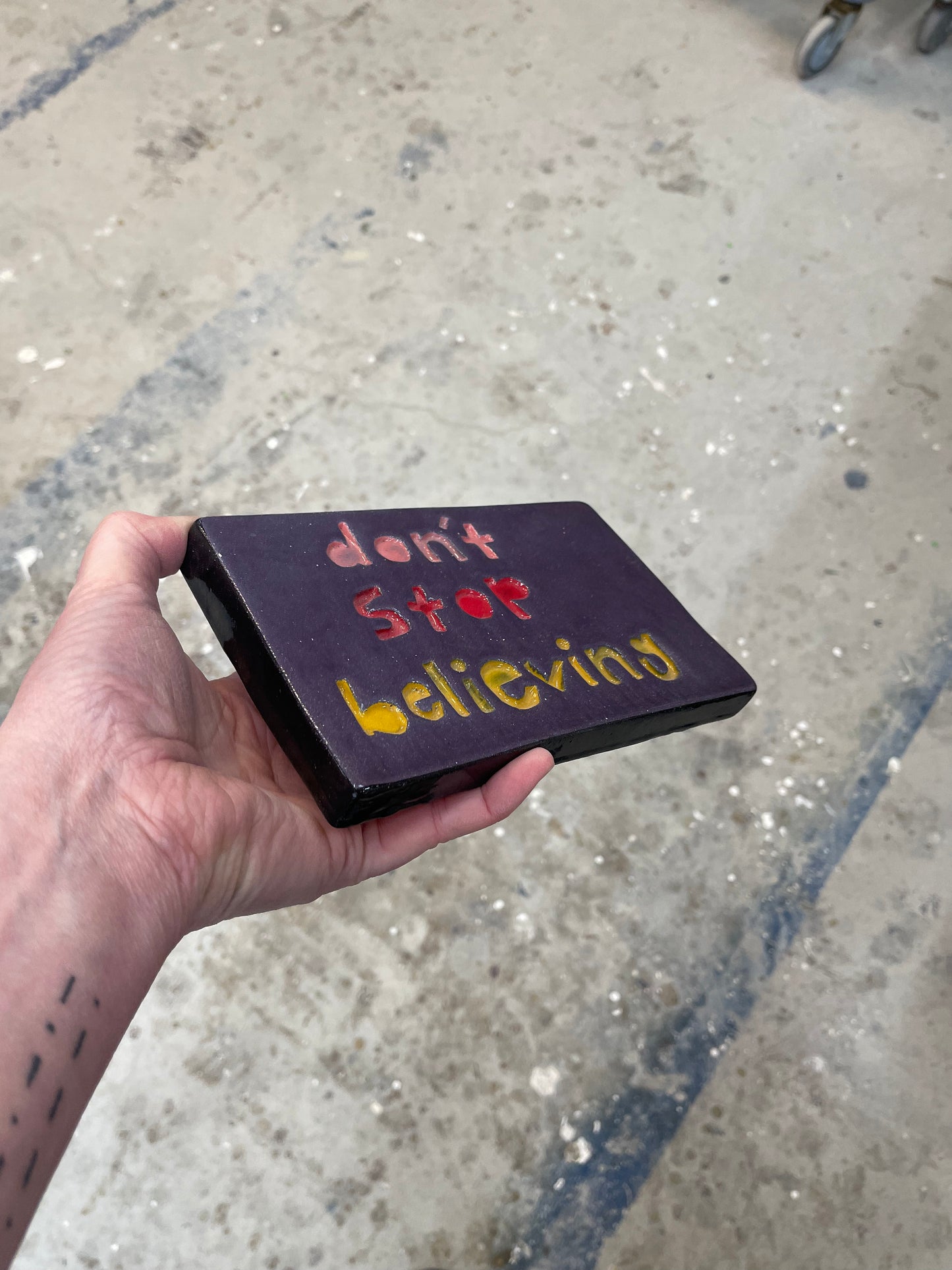 Don’t stop believing tile.