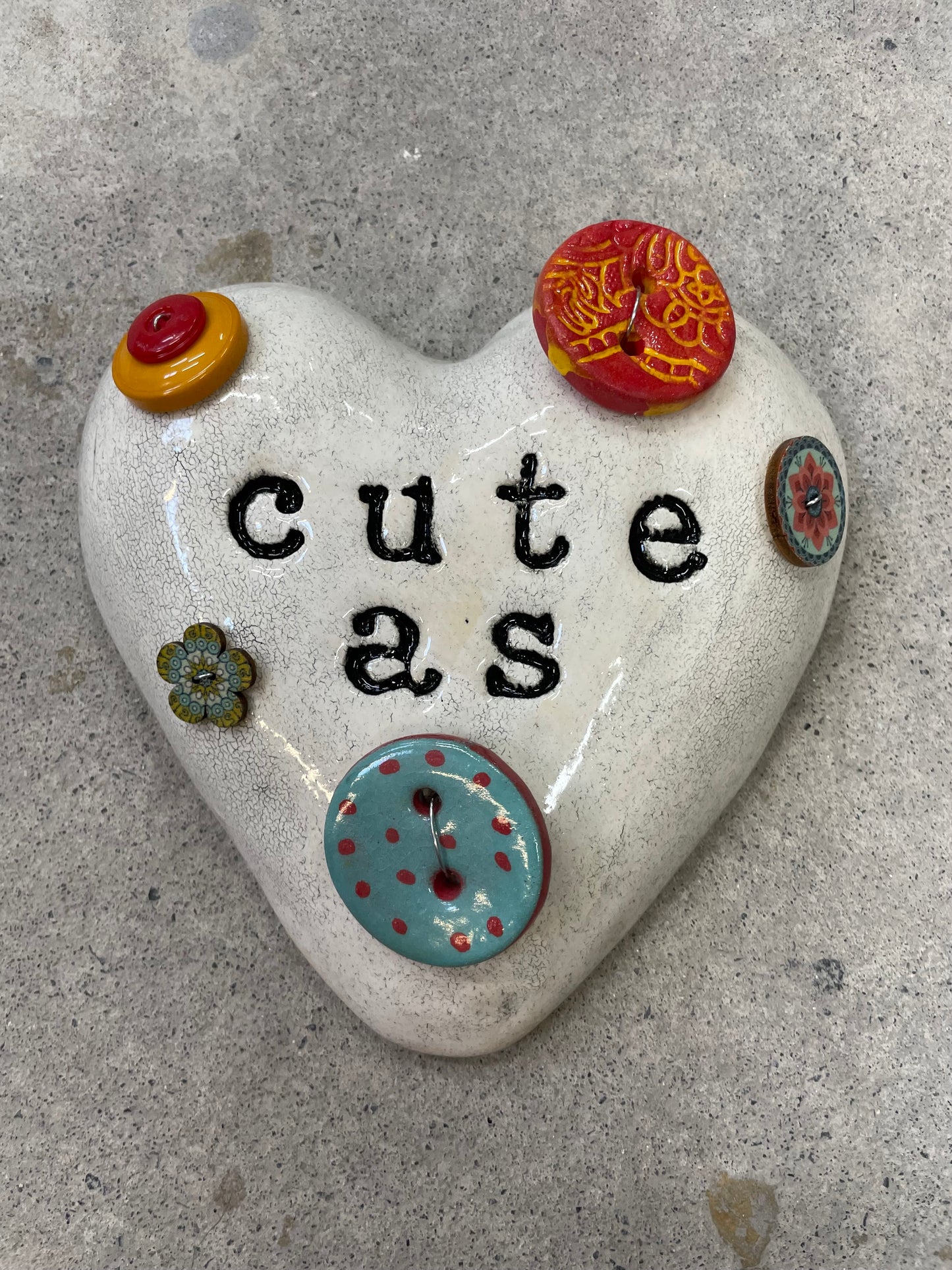 Cute as a button wall heart.