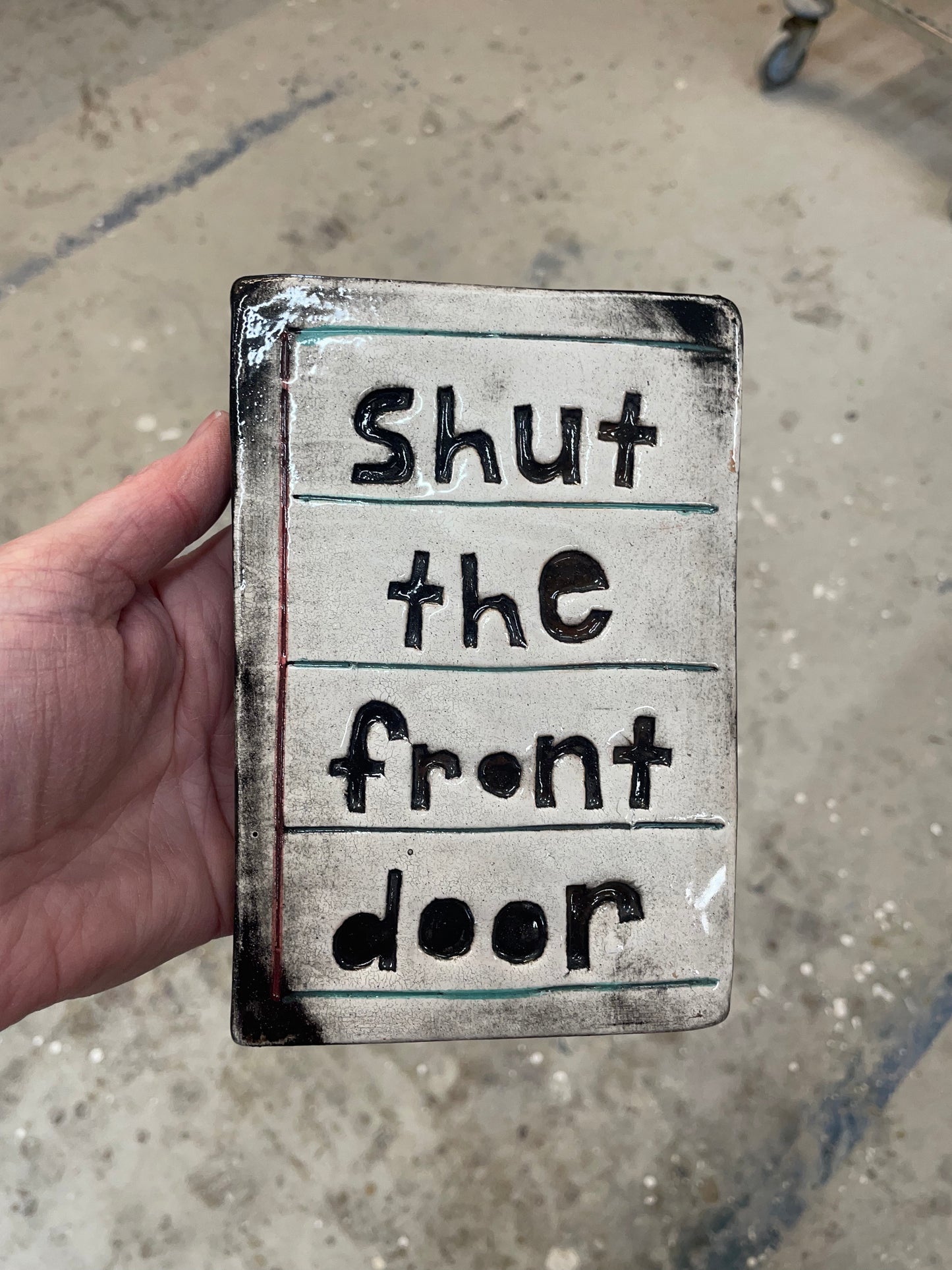 Shut the front door tile.