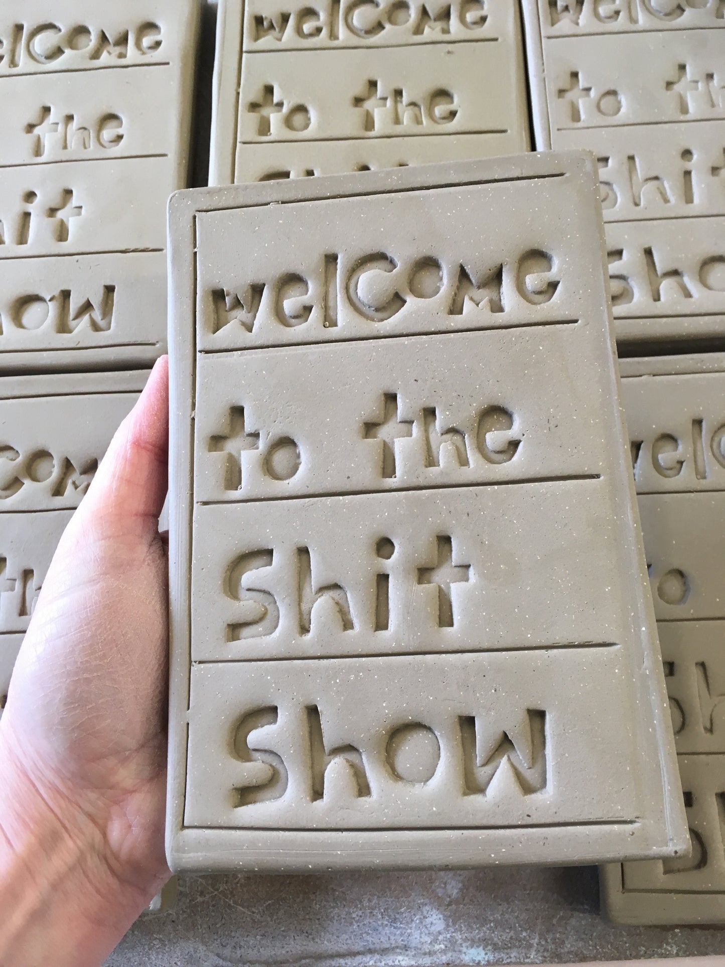 Welcome to the shit show tile.