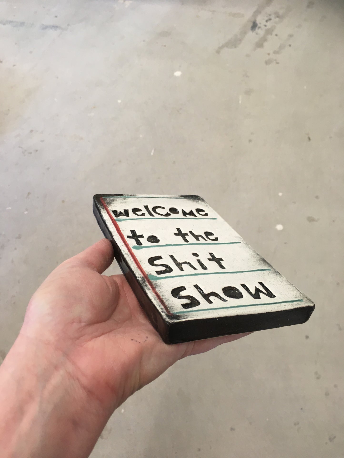 Welcome to the shit show tile.