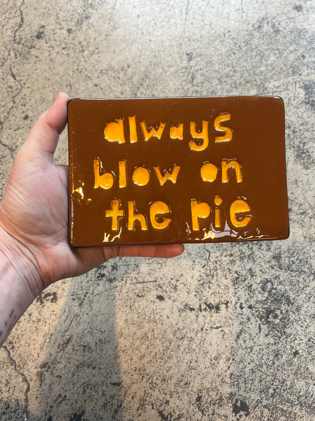 always blow on the pie tile
