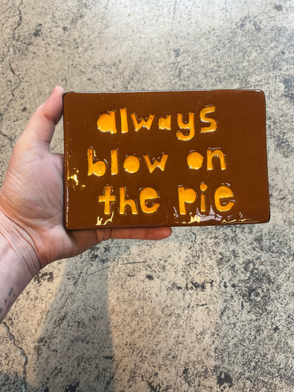 always blow on the pie tile