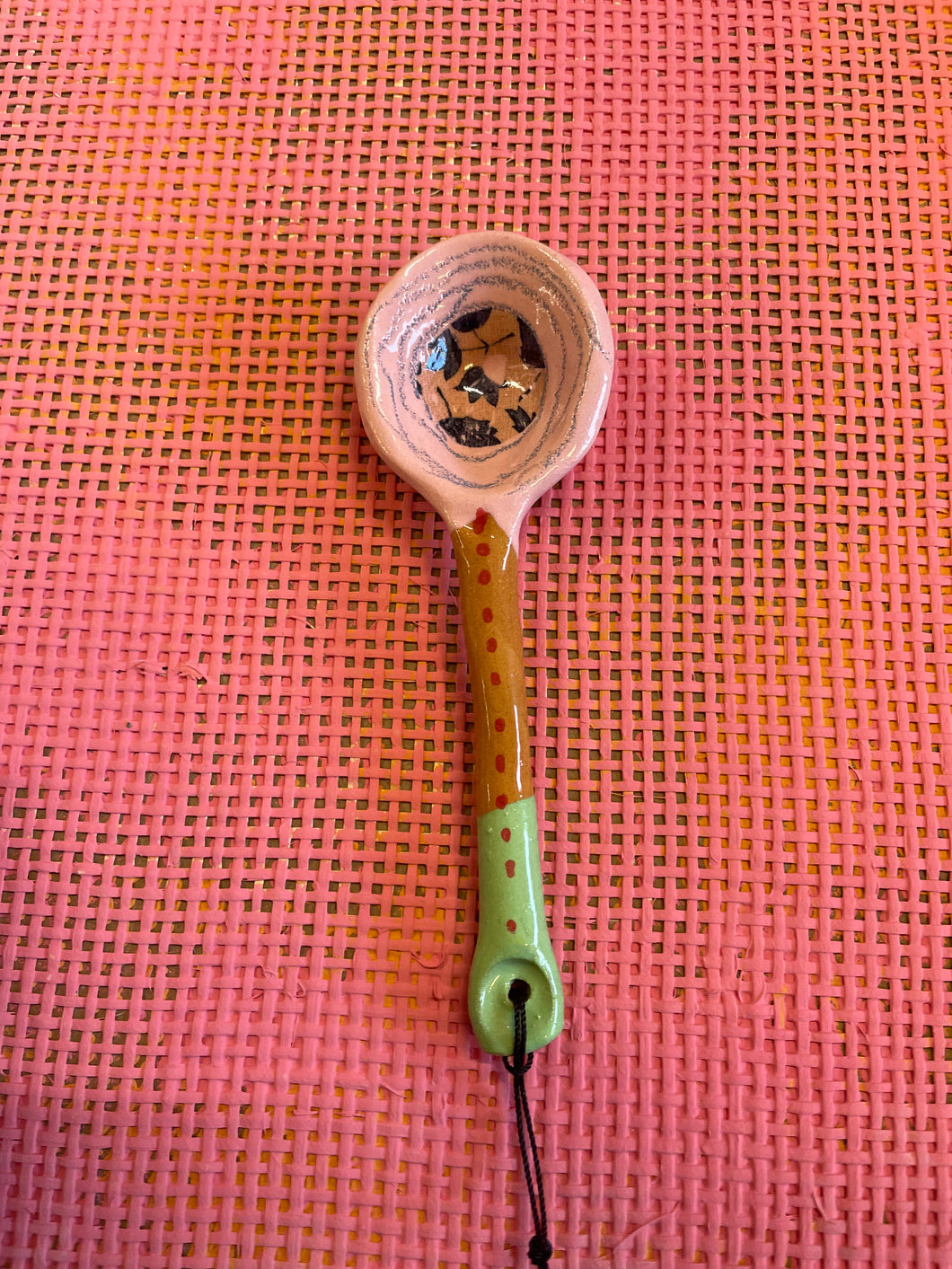 Decorative spoon pink and green.