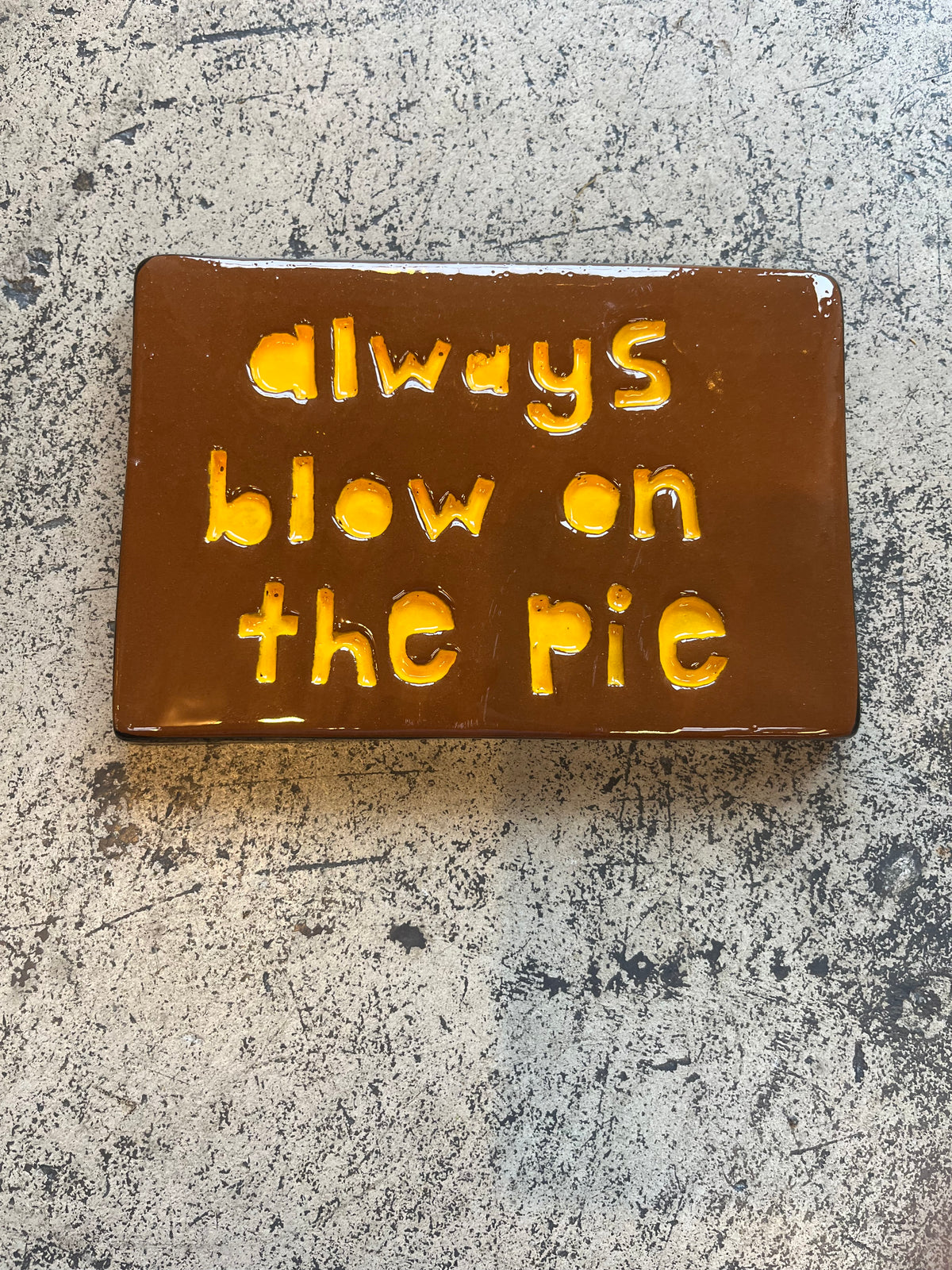 always blow on the pie tile