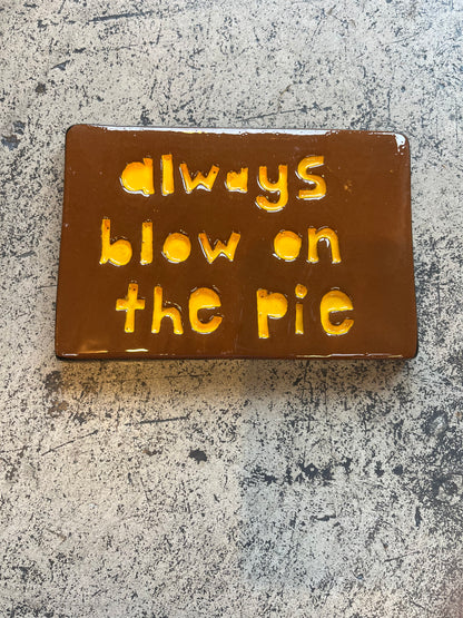 always blow on the pie tile