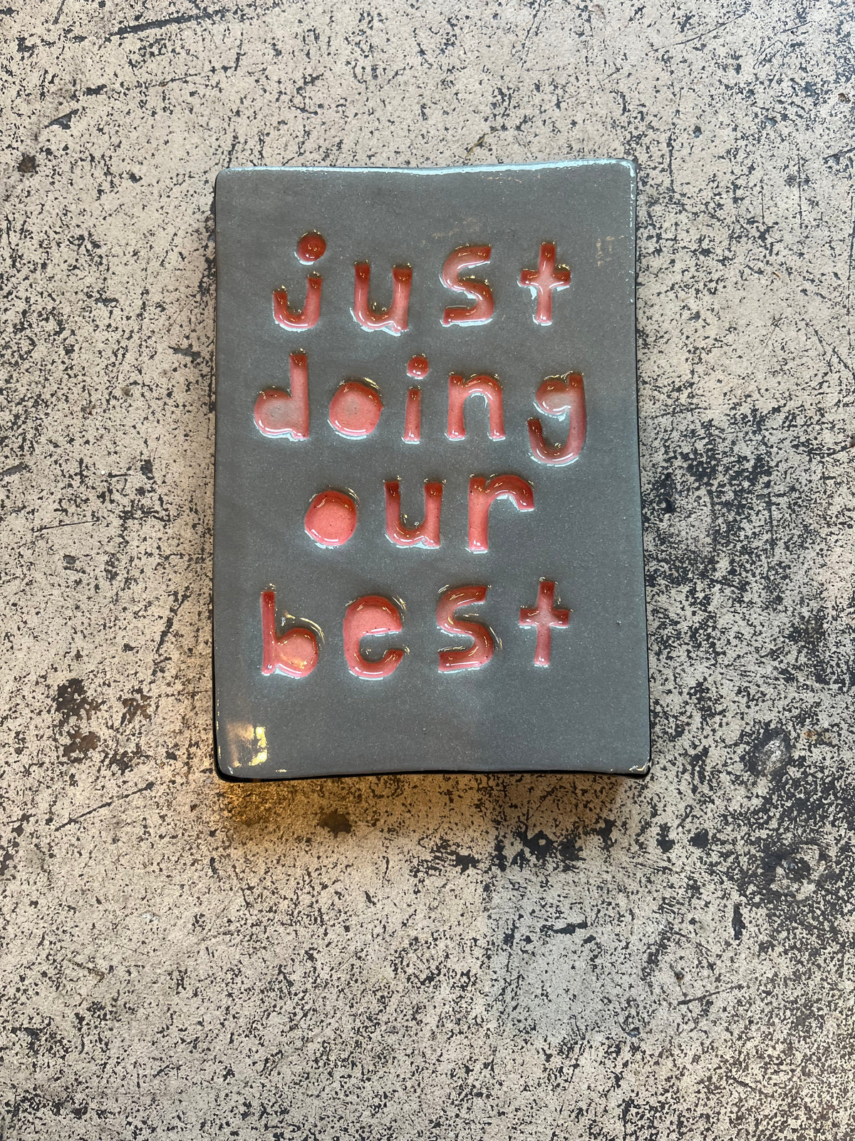 just doing our best tile