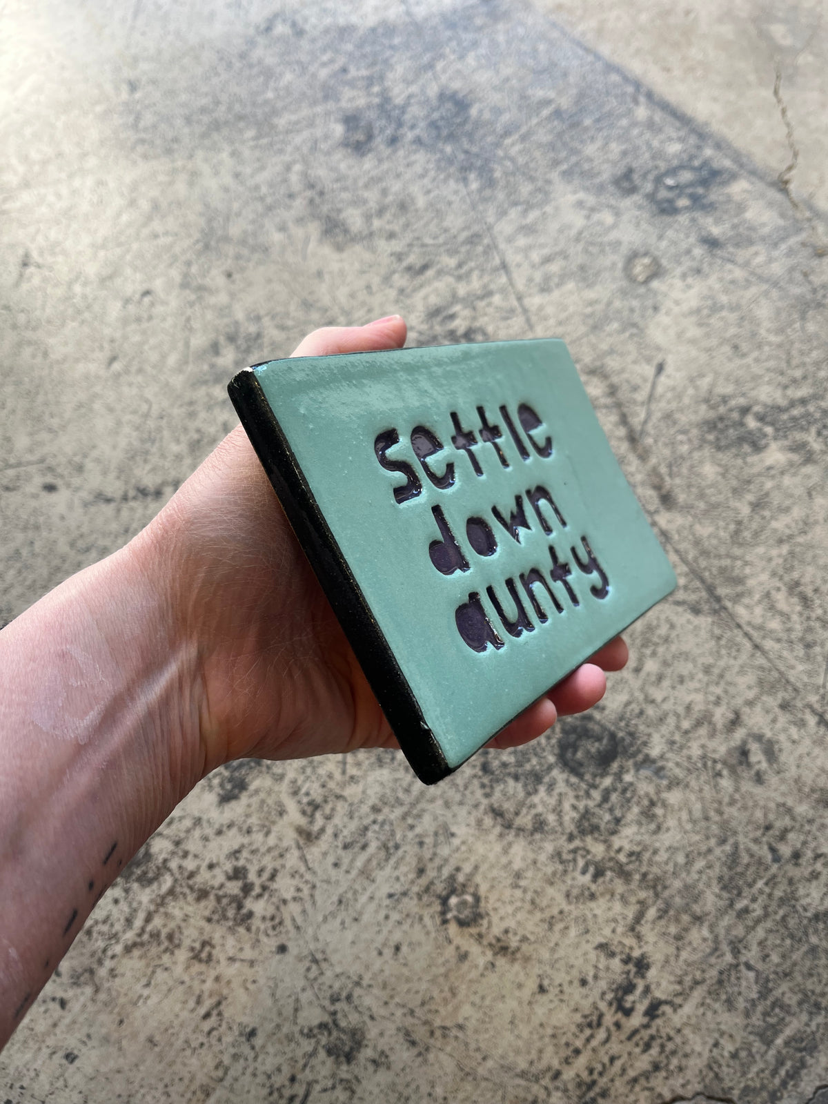 Settle down aunty tile