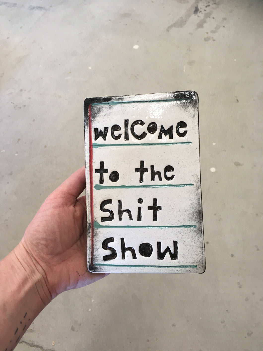 Welcome to the shit show tile.